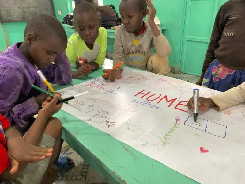 Children drawing in the dining room