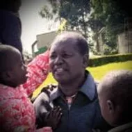 Joseph Chepkwony surrounded by children